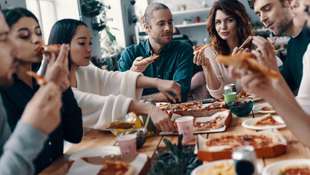 Friends sharing a relaxed meal together at a table
