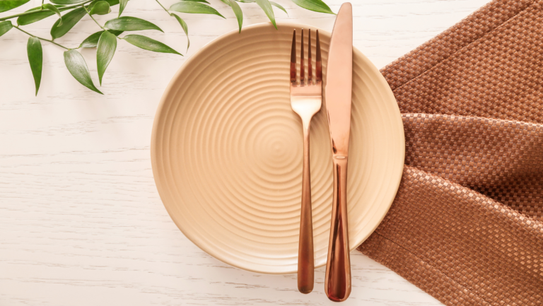 'A single place setting at a table, prepared calmly for a mea